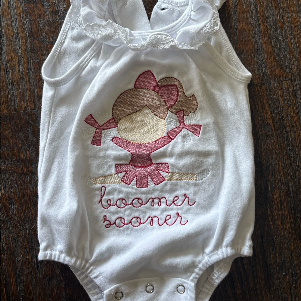 OU White Baby Onesie with Cheerleader Design with Boomer Sooner